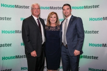 Mike Kuhn and Ryan Kuhn accepting award from Kathleen Kuhn, President