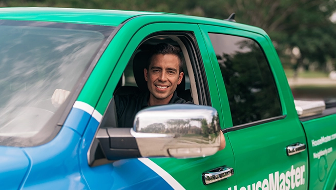 Technician driving a truck.