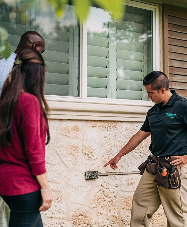 HouseMaster inspector showing couple open outdoor electrical box.