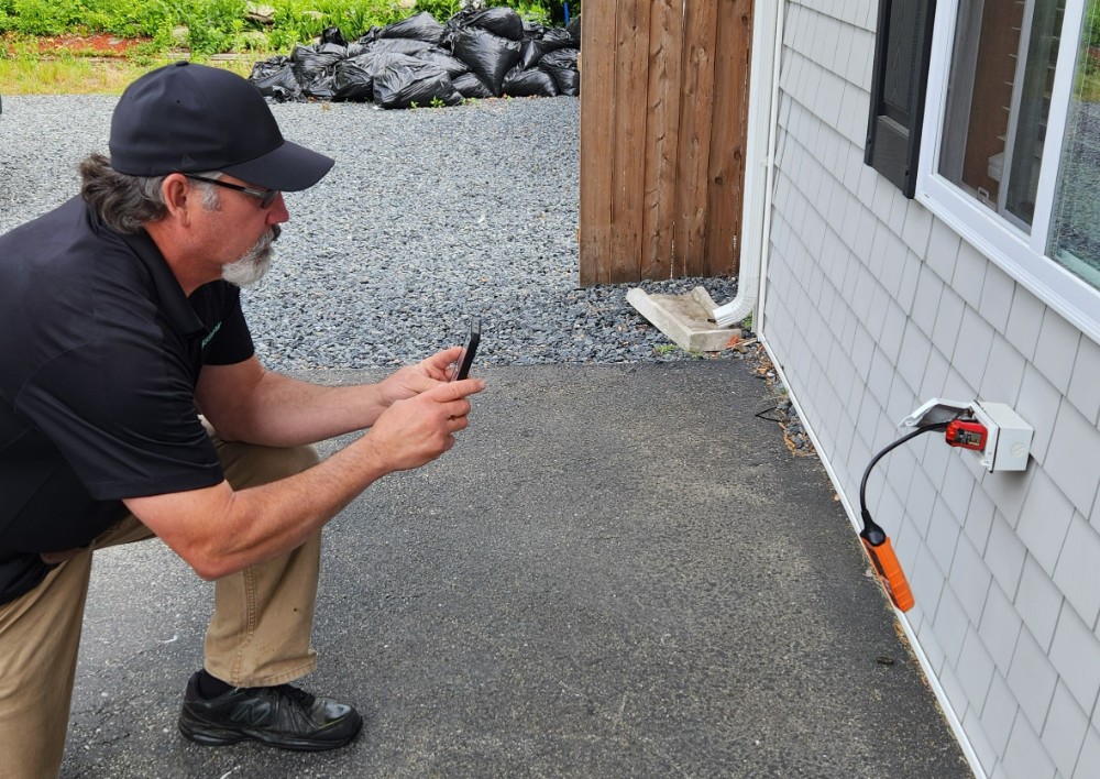 Inspector Paul inspecting an outside GFCI.
