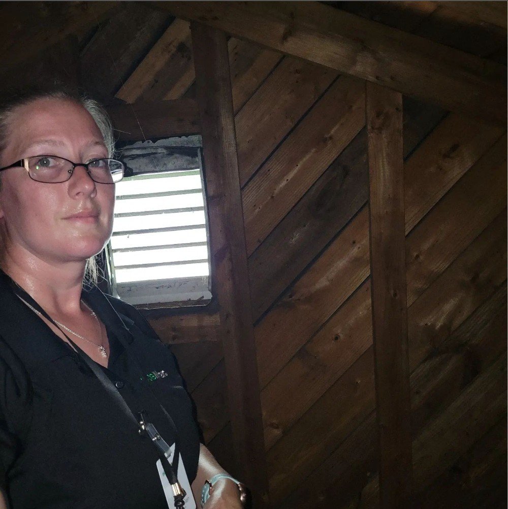 photo of inspector inspecting a hot attic | house master home inspection knoxville tn