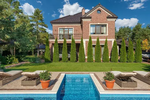 Exterior of home with pool.