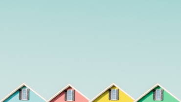 Four brightly colored home eaves.