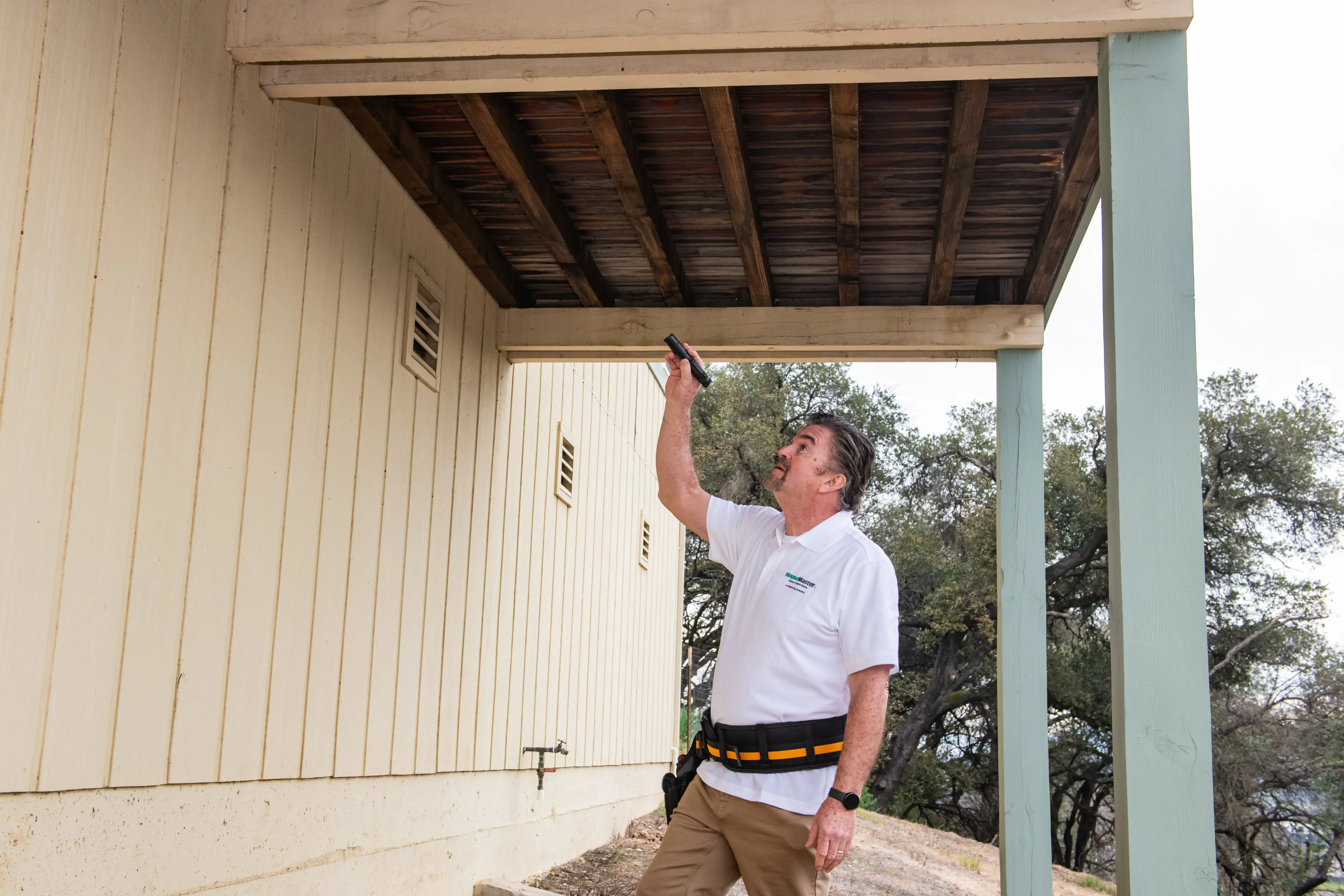 HouseMaster technician inspecting a deck.
