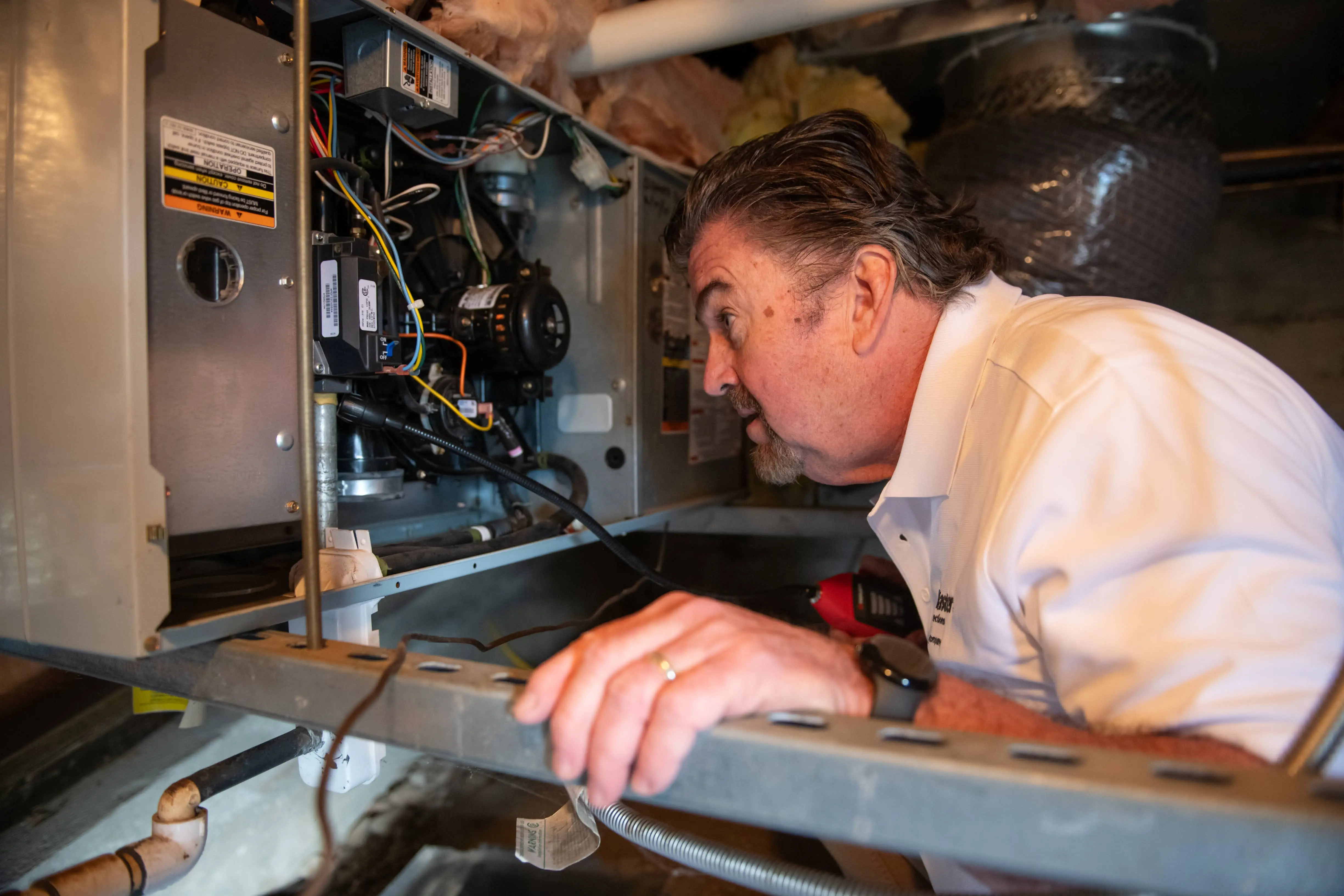 HouseMaster technician inspecting electrical.